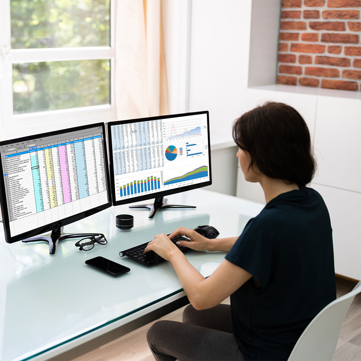 woman with computer screens